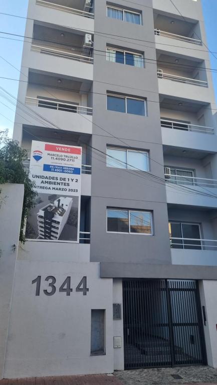 a building with a sign on the side of it at Nice San Telmo in Buenos Aires