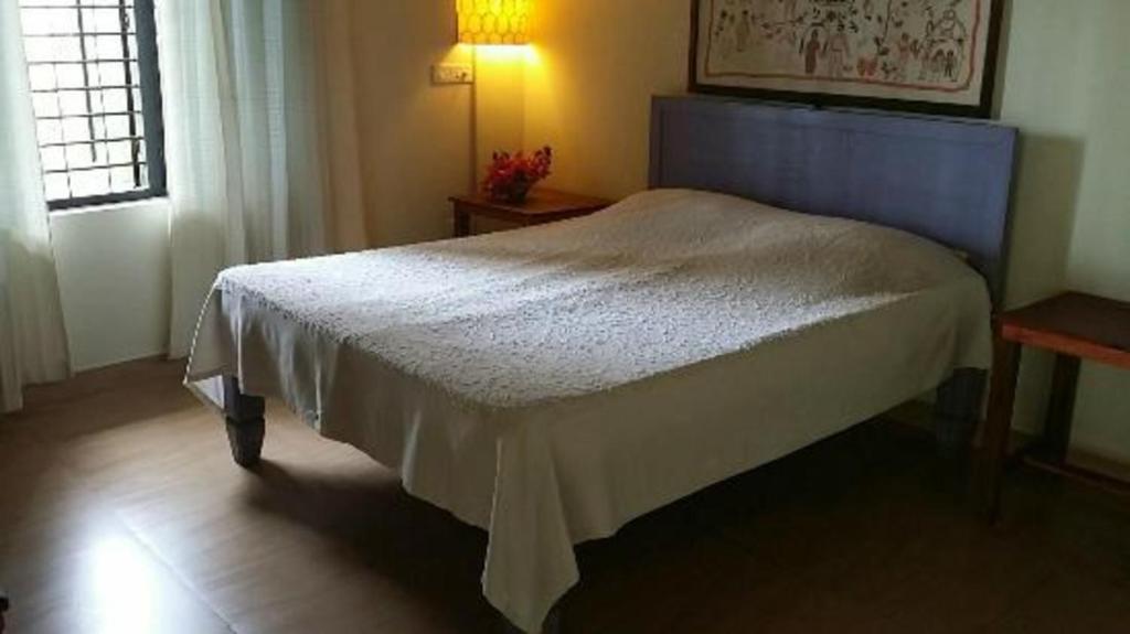 Postel nebo postele na pokoji v ubytování Magnolia Guesthouse Varkala