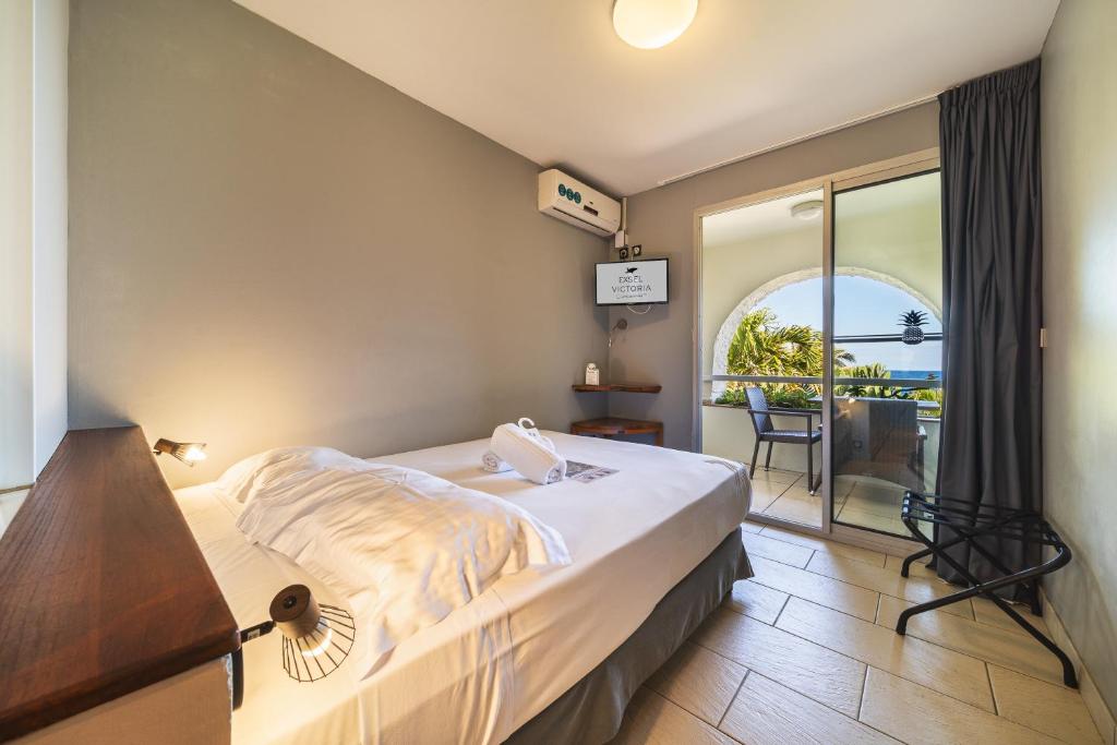 Postel nebo postele na pokoji v ubytování Hotel Exsel Victoria