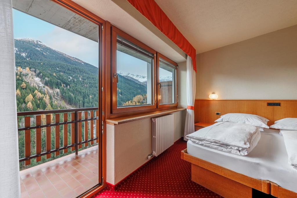 Postel nebo postele na pokoji v ubytování Hotel Miravalle