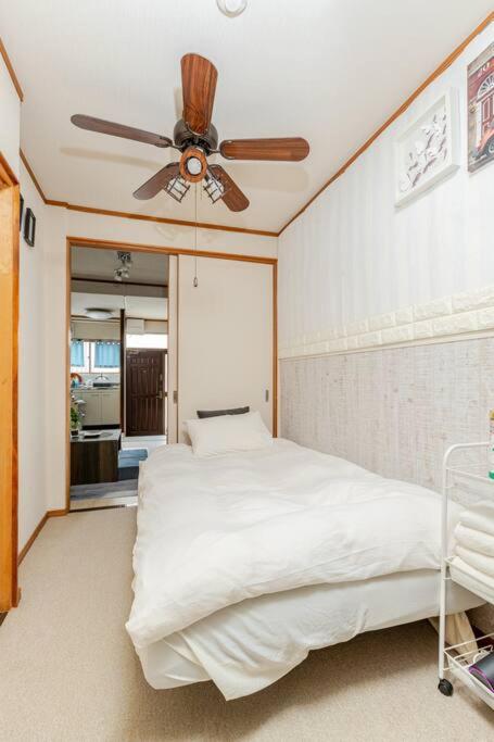 Cama ou camas em um quarto em Momodani 72 two-story detached house