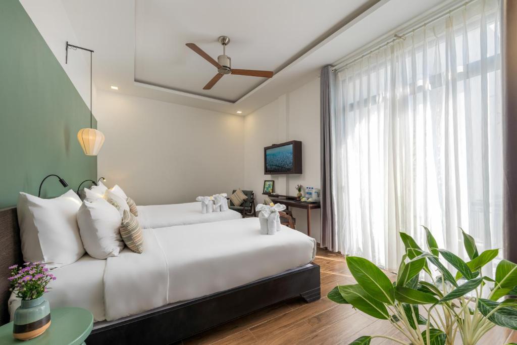 Volar Hoi An - Deluxe Triple Room с балконом