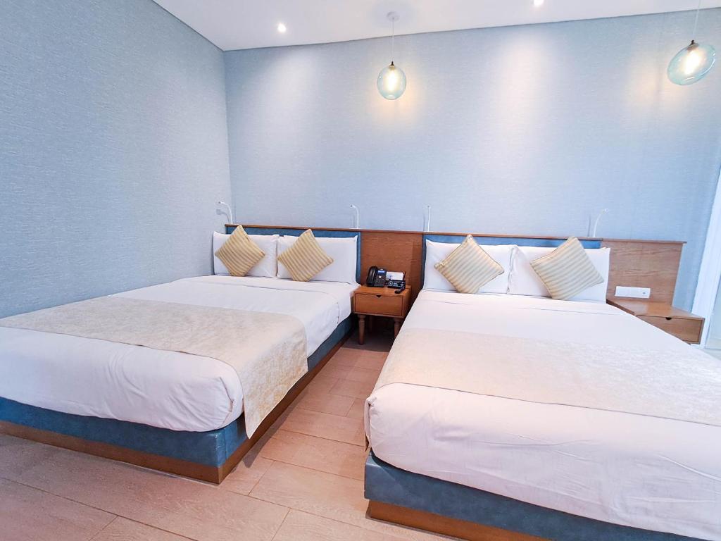 Postel nebo postele na pokoji v ubytování Hotel H2O