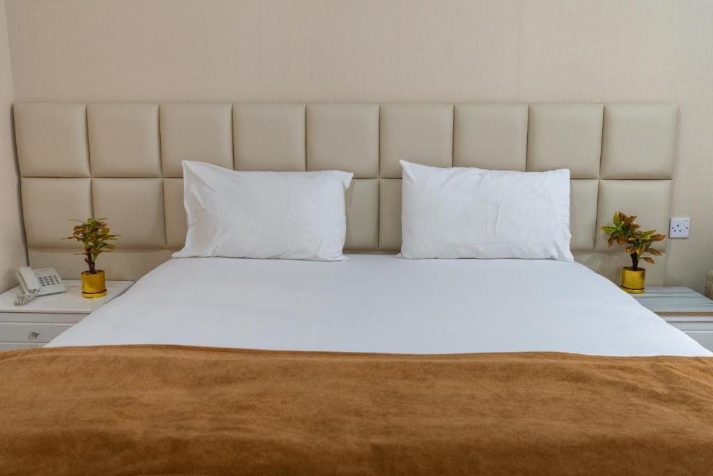 Voodi või voodid majutusasutuse Sur Inn Hotel Apartments صور ان للشقق الفندقية toas