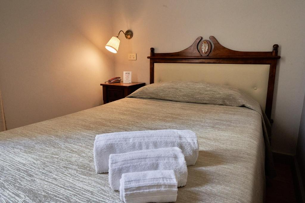 Posteľ alebo postele v izbe v ubytovaní La Collegiata Guest House