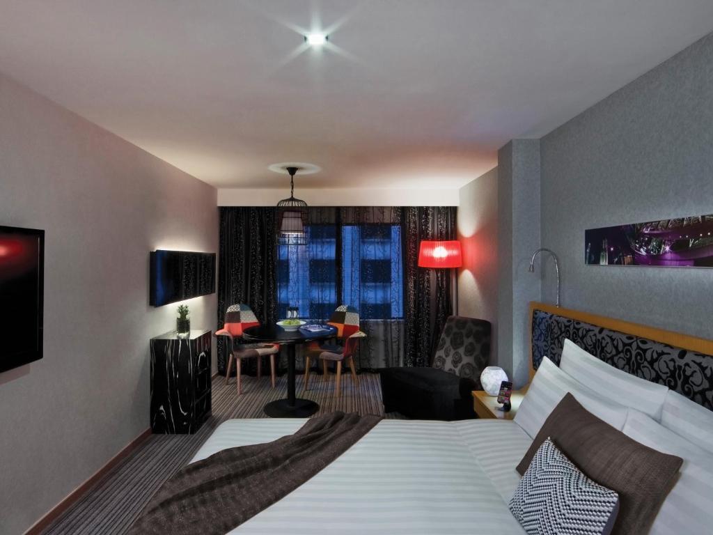 Postel nebo postele na pokoji v ubytování Kew Green Hotel Wanchai Hong Kong