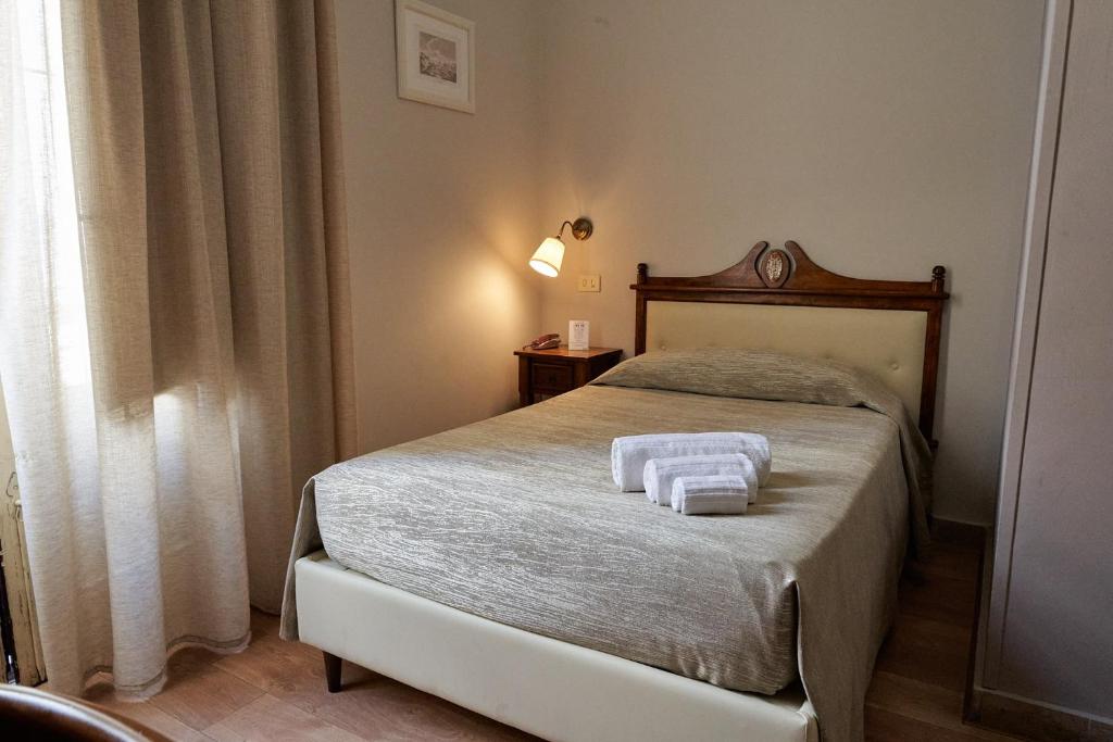 Posteľ alebo postele v izbe v ubytovaní La Collegiata Guest House