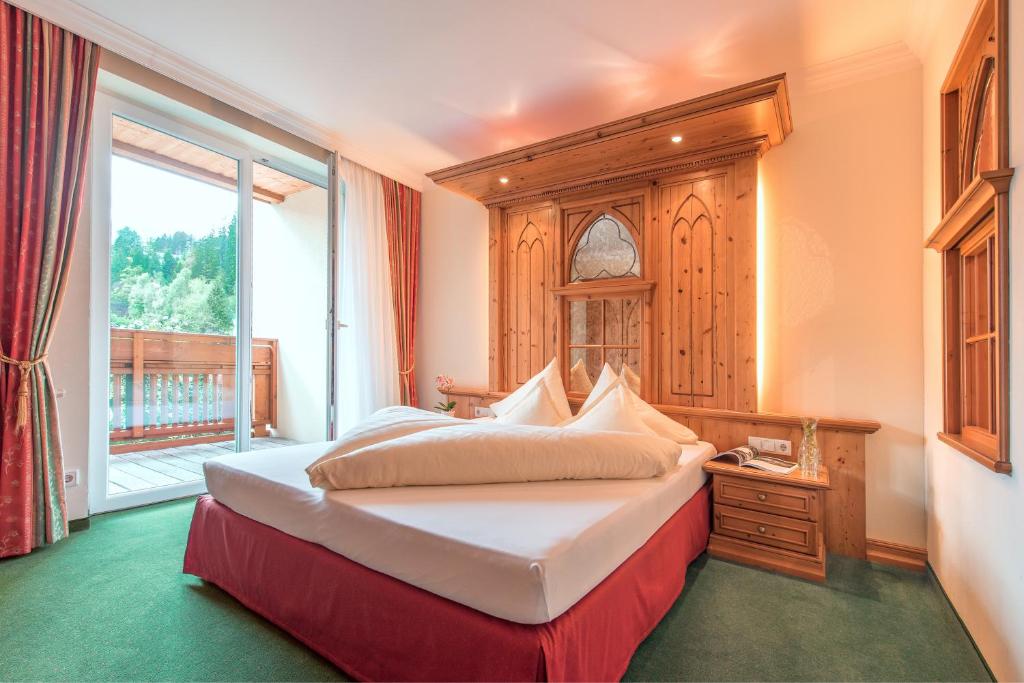 Ein Bett oder Betten in einem Zimmer der Unterkunft Hotel Vitalquelle Montafon