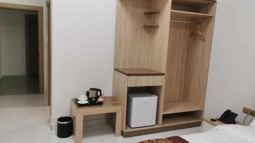 Příslušenství pro přípravu čaje a kávy v ubytování Liza Hotel