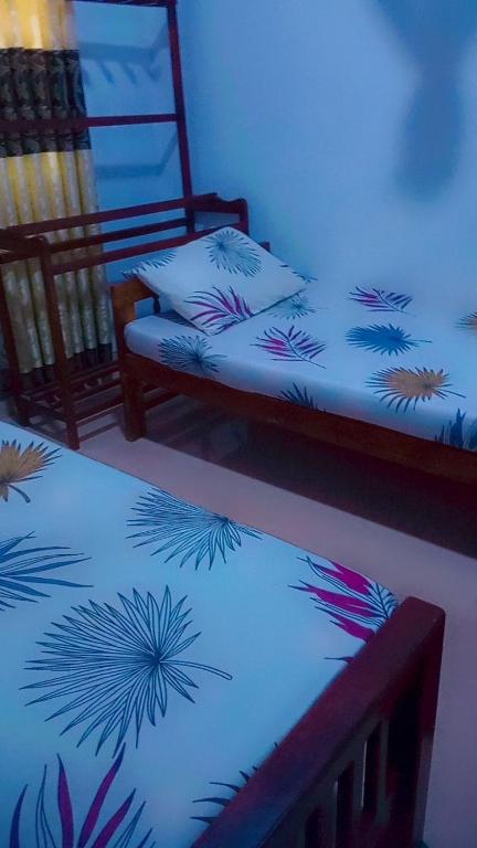 Postel nebo postele na pokoji v ubytování Chathuni Holiday Home