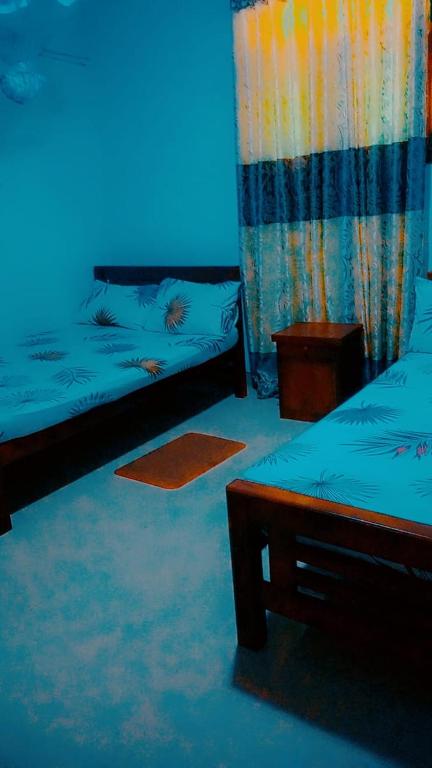 Postel nebo postele na pokoji v ubytování Chathuni Holiday Home