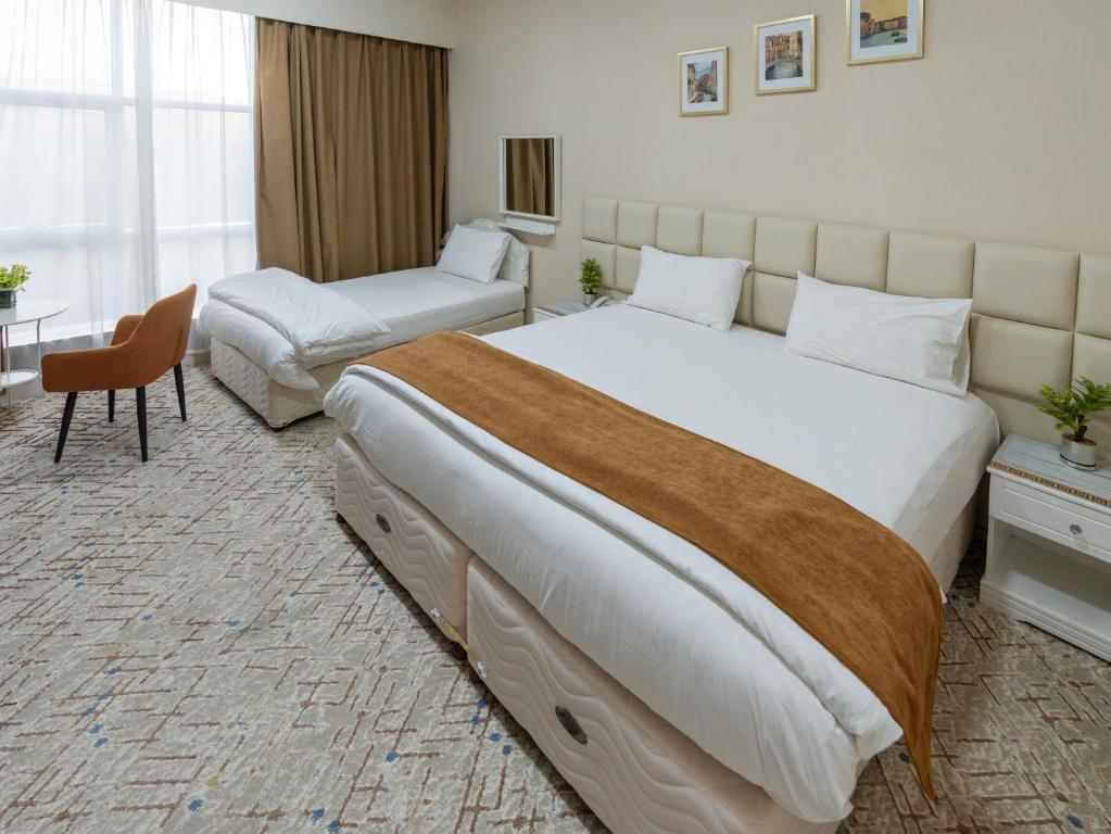 Voodi või voodid majutusasutuse Sur Inn Hotel Apartments صور ان للشقق الفندقية toas