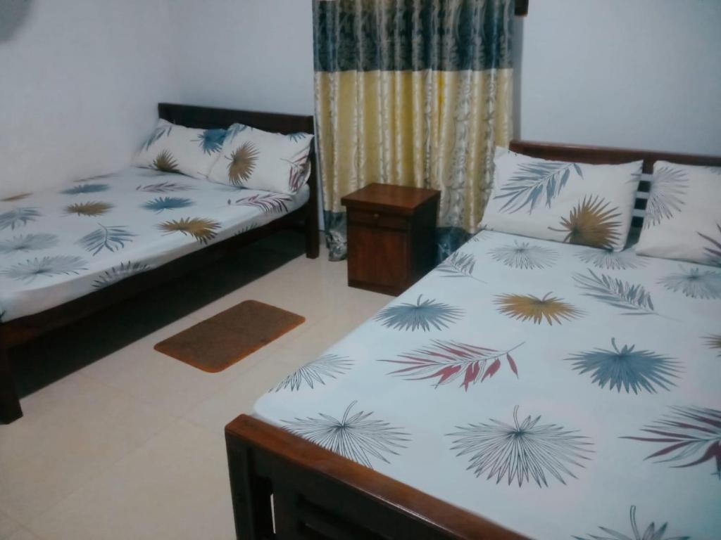Postel nebo postele na pokoji v ubytování Chathuni Holiday Home