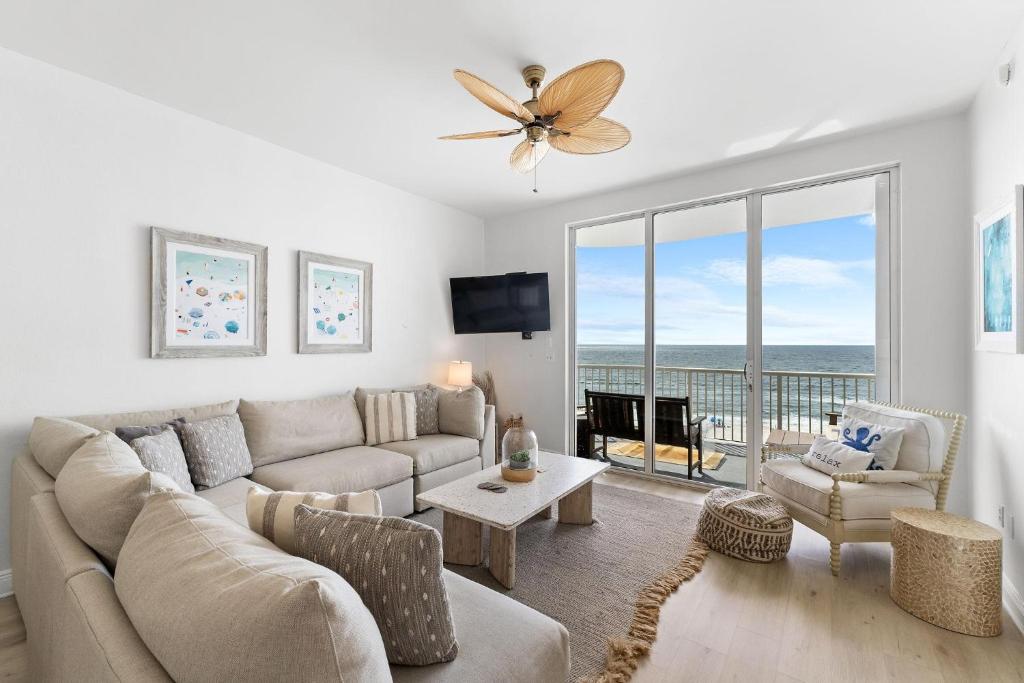 a living room with a couch and a table at Spanish Key 603 in Perdido Key