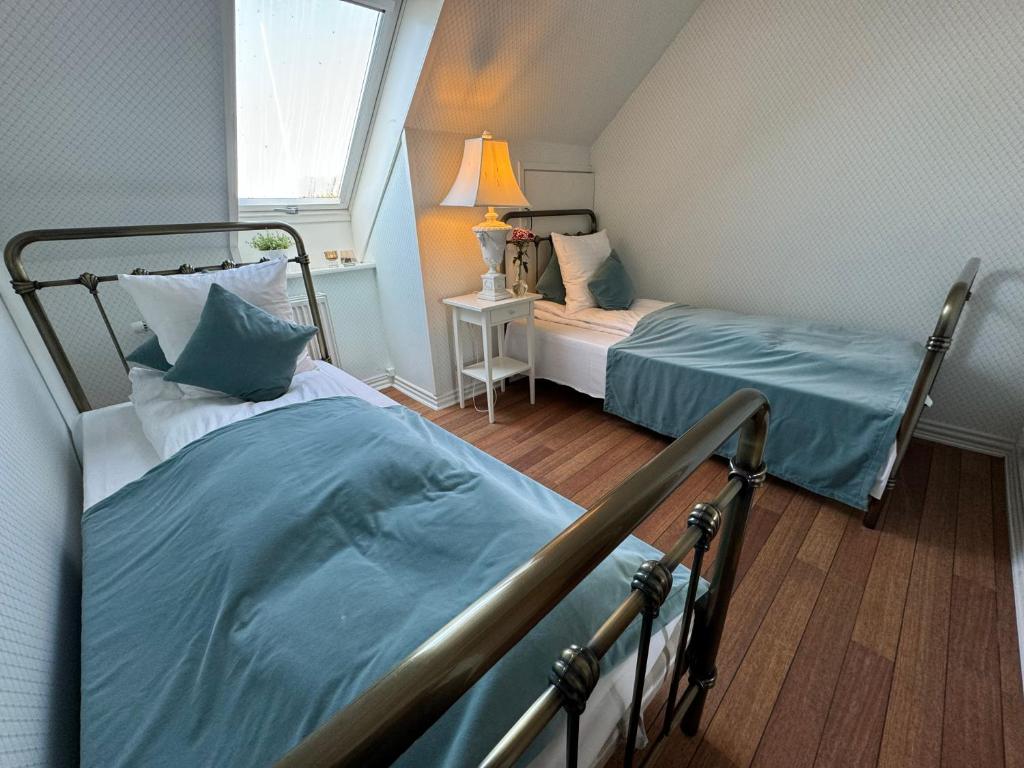 Postel nebo postele na pokoji v ubytování Rold Gl Kro