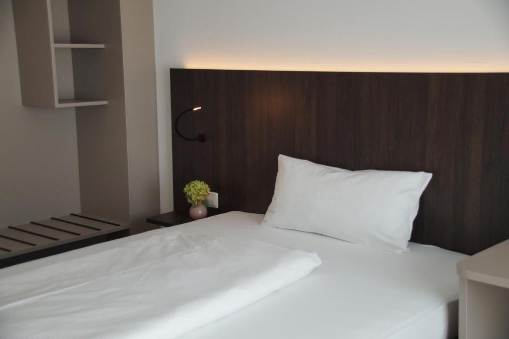 Postel nebo postele na pokoji v ubytování Hotel Feyrer