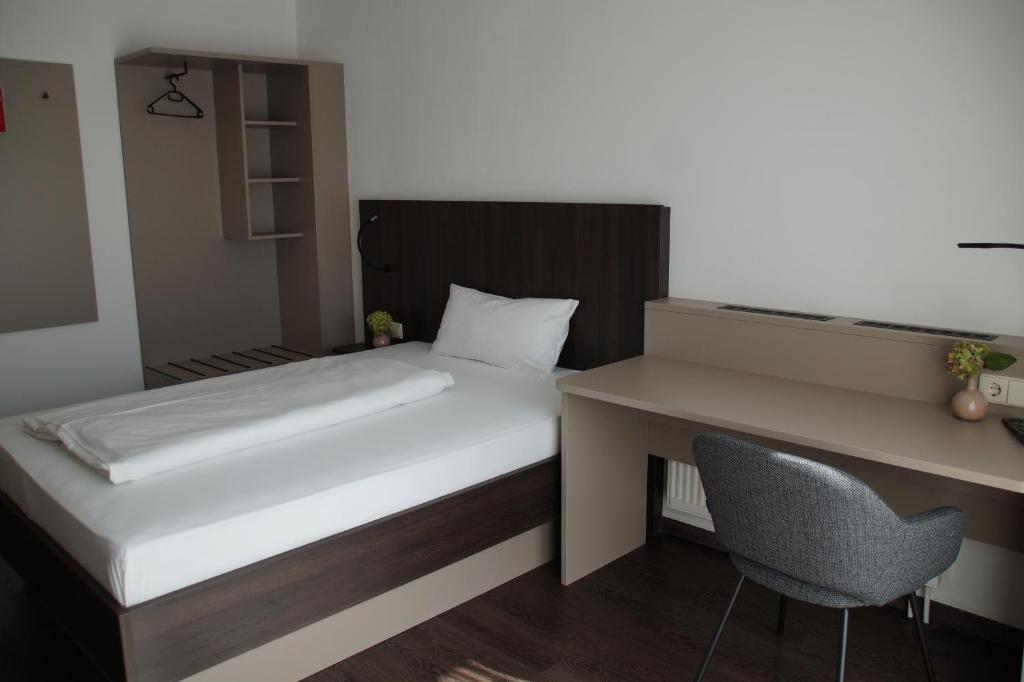 Postel nebo postele na pokoji v ubytování Hotel Feyrer