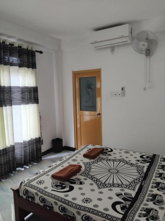 Postel nebo postele na pokoji v ubytování Kelum Homestay