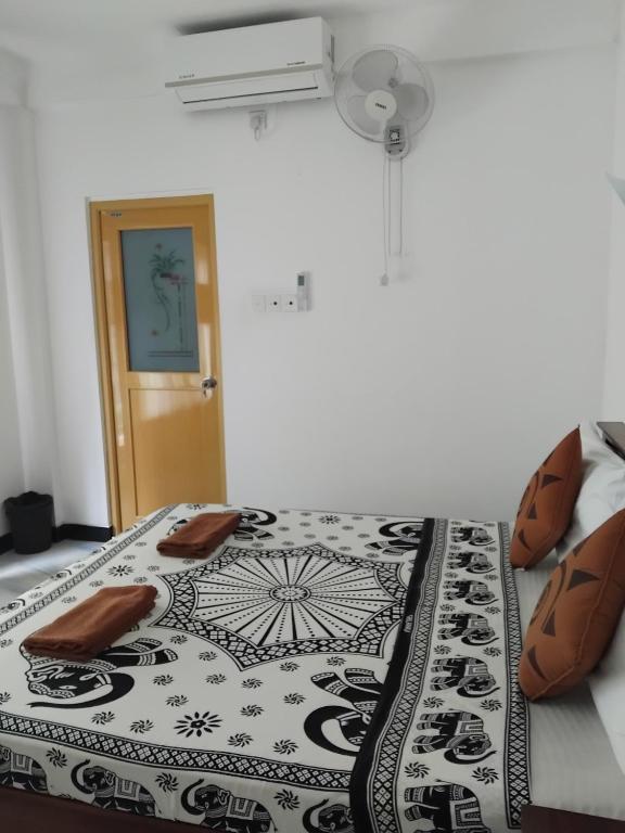 Postel nebo postele na pokoji v ubytování Kelum Homestay