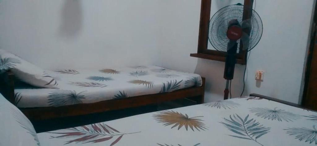 Postel nebo postele na pokoji v ubytování Chathuni Holiday Home