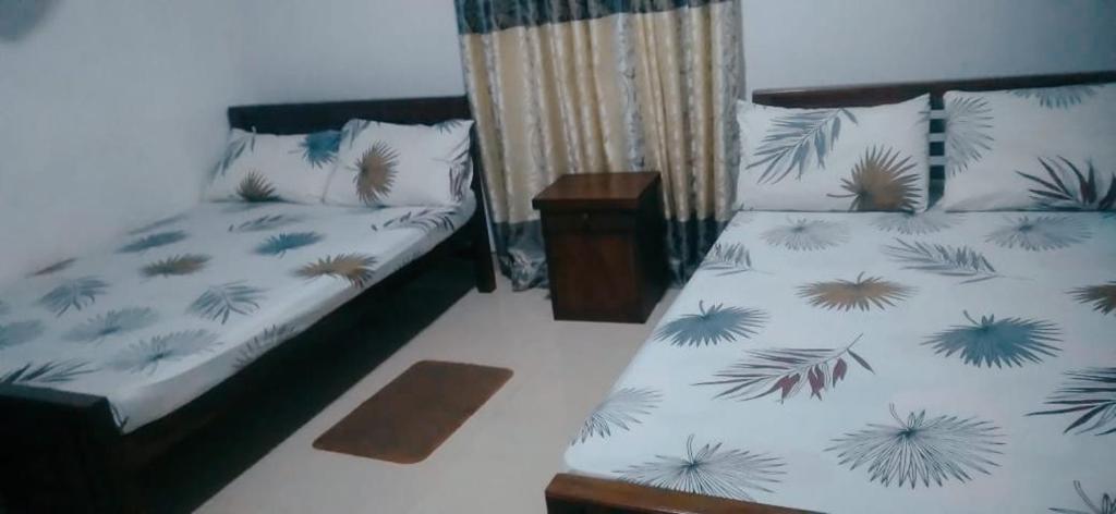 Postel nebo postele na pokoji v ubytování Chathuni Holiday Home