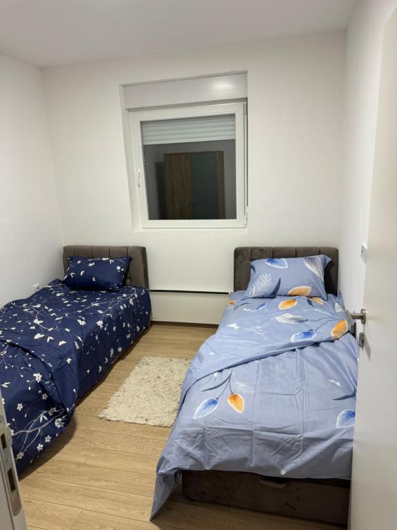 Postel nebo postele na pokoji v ubytování Brasic Apartman