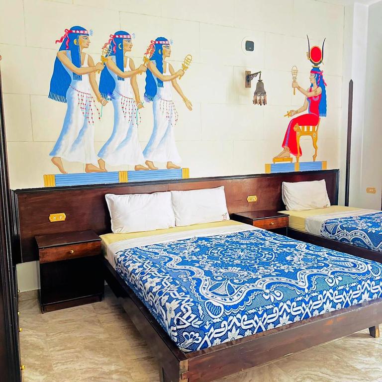 Postel nebo postele na pokoji v ubytování El Nakhil Hotel