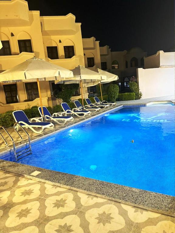 Bazén v ubytování El Nakhil Hotel nebo v jeho okolí