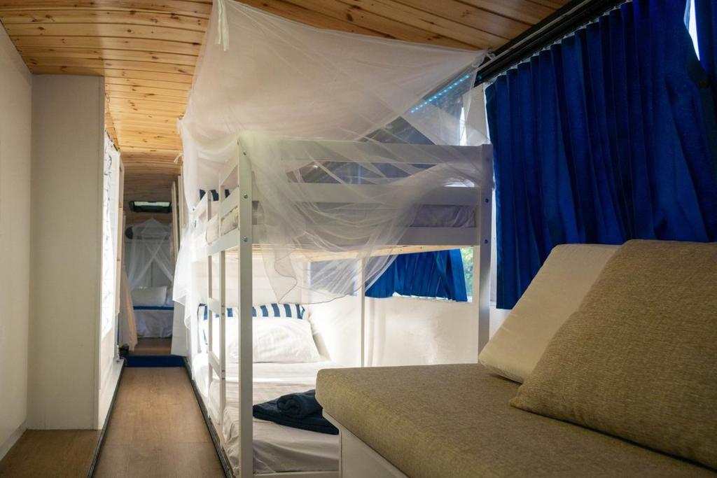 Postel nebo postele na pokoji v ubytování VamosBus