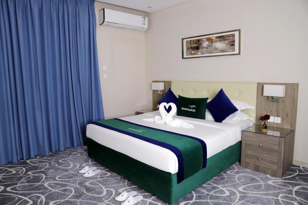 Postel nebo postele na pokoji v ubytování Sunrise Suites