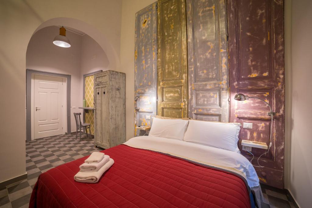Posteľ alebo postele v izbe v ubytovaní The Foria House by House In Naples