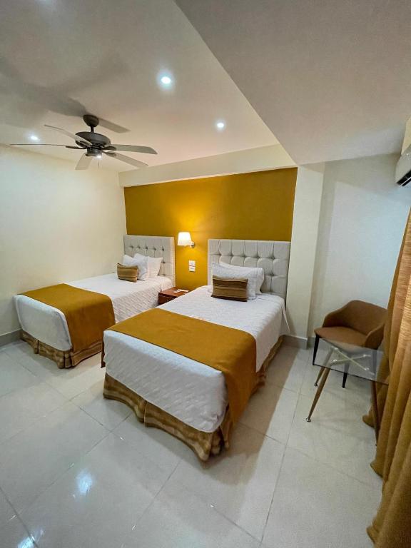 Postel nebo postele na pokoji v ubytování Nilka Hotel Boutique