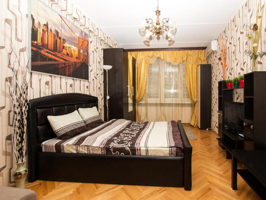 
Кровать или кровати в номере Apartlux на Новом Арбате

