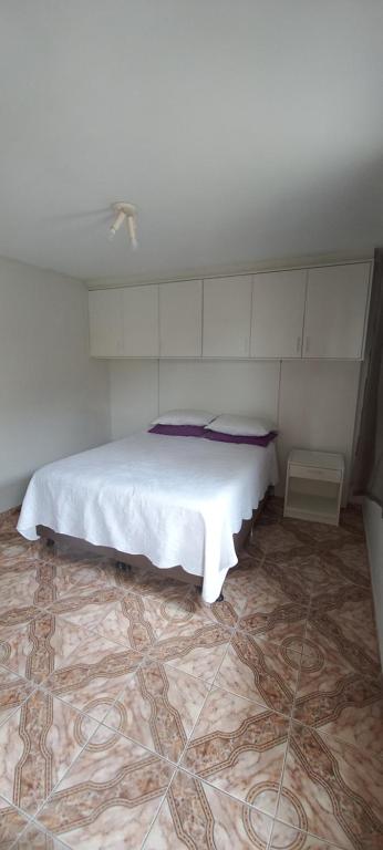 Postel nebo postele na pokoji v ubytování Residencial Vitor Studio 1
