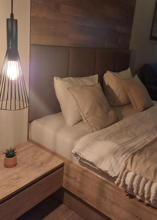 Postel nebo postele na pokoji v ubytování Apartman Viva Milmari