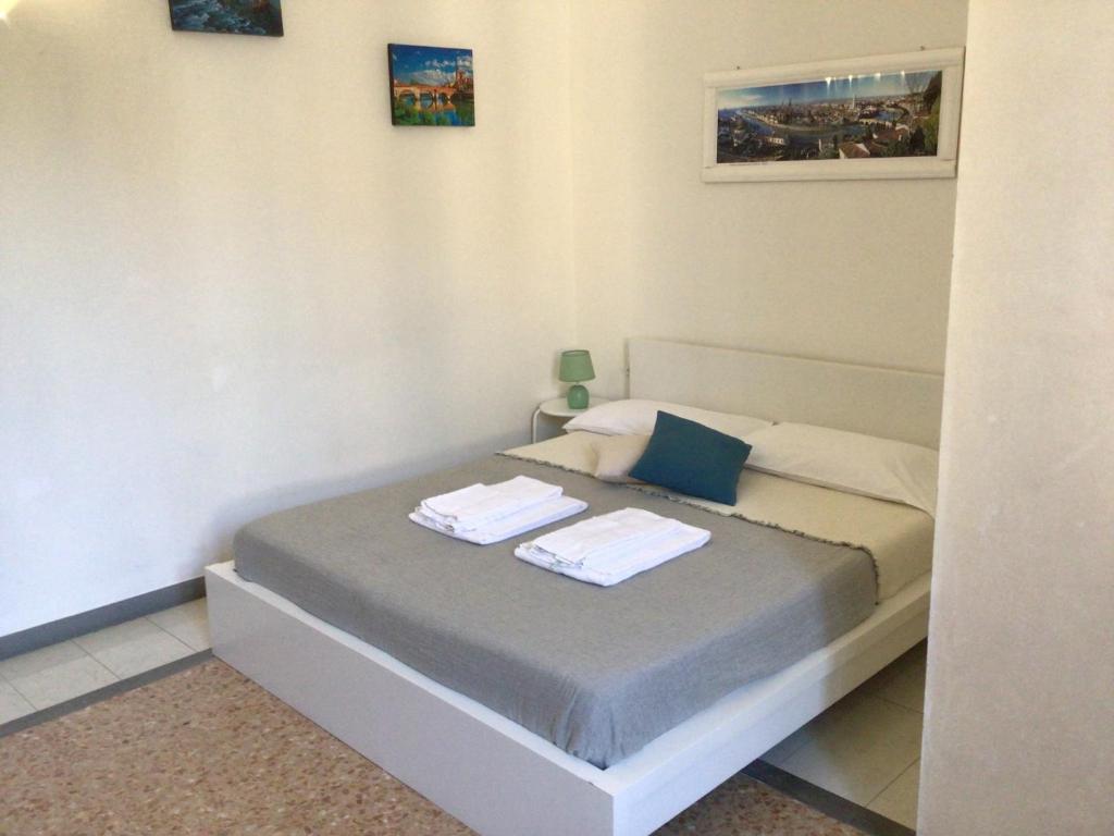 Posteľ alebo postele v izbe v ubytovaní A due passi da Giulietta-Casa Montecchi