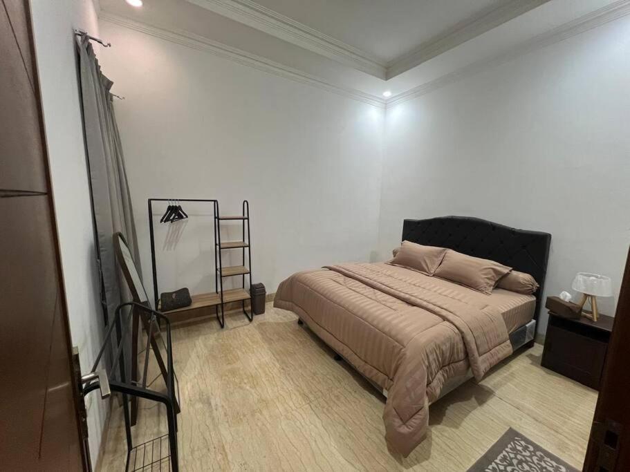 Postel nebo postele na pokoji v ubytování Durti Indah Homestay