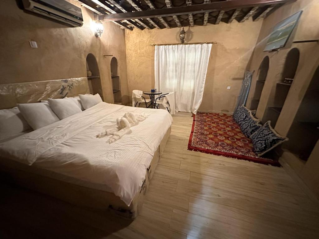 Postel nebo postele na pokoji v ubytování Al-Ghanima Rest House
