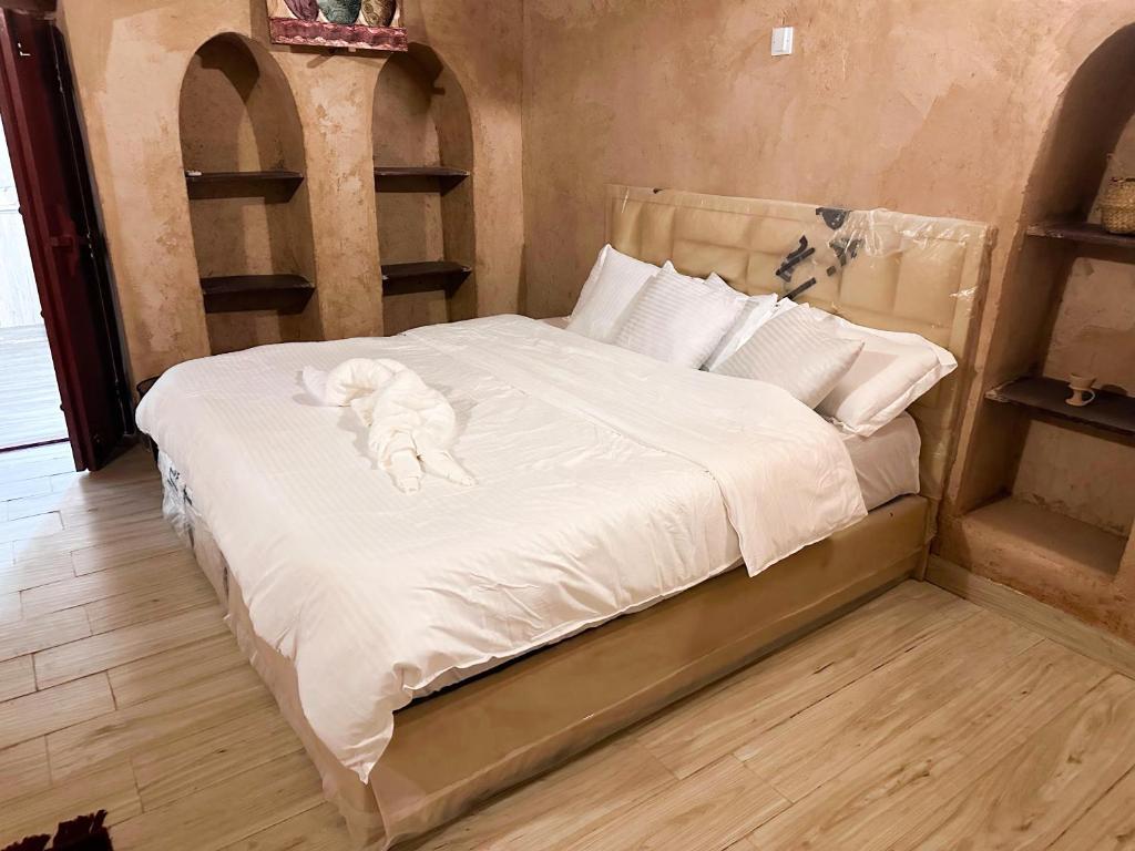 Postel nebo postele na pokoji v ubytování Al-Ghanima Rest House