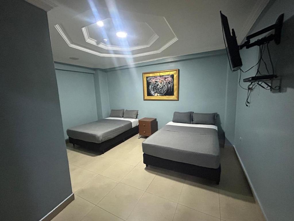 Postel nebo postele na pokoji v ubytování Hotel Caribe