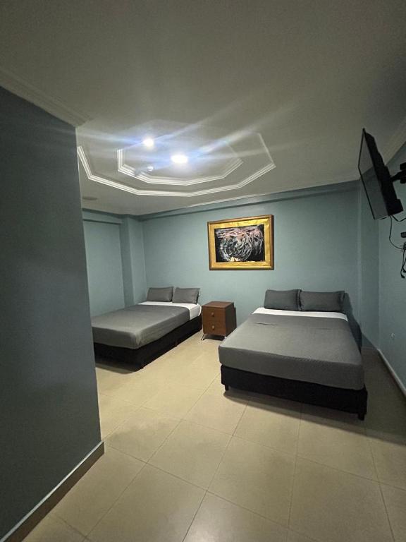 Postel nebo postele na pokoji v ubytování Hotel Caribe