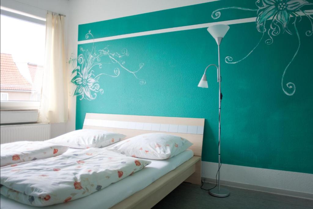 Voodi või voodid majutusasutuse Hostel Jena toas
