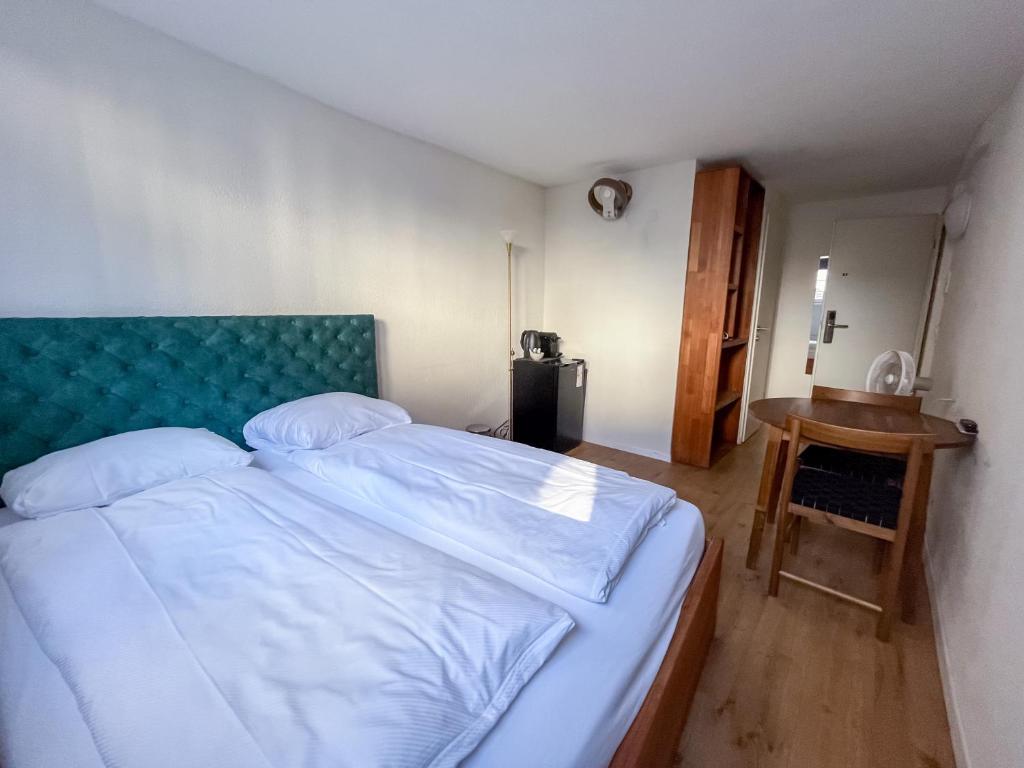 Uma cama ou camas num quarto em stattHotel