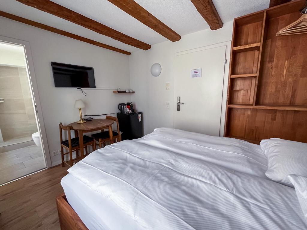 Uma cama ou camas num quarto em stattHotel