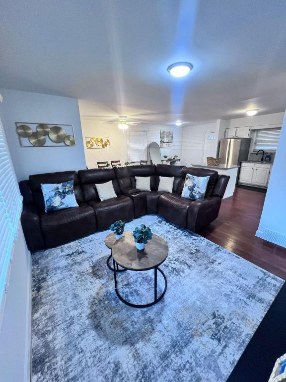 a living room with a couch and a table at Comfortable 3BR Close to All in Dayton