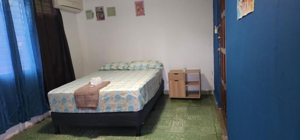 Ένα ή περισσότερα κρεβάτια σε δωμάτιο στο Cuartos independientes con baño privado - Casa La Dolce Vita Las Tablas