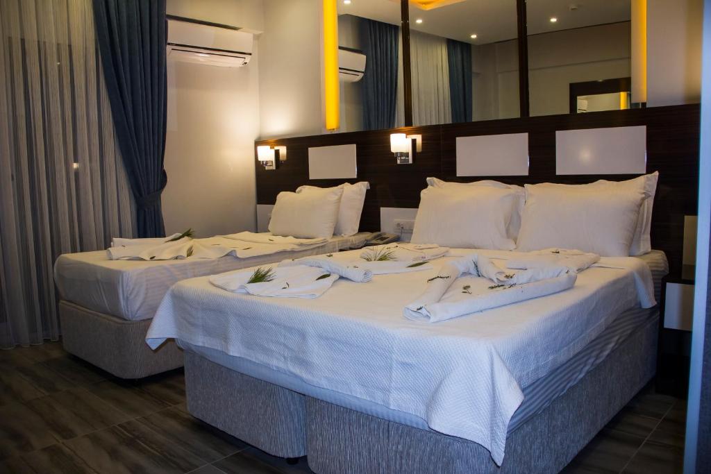 Postel nebo postele na pokoji v ubytování Pamukkale Termal Ece Otel