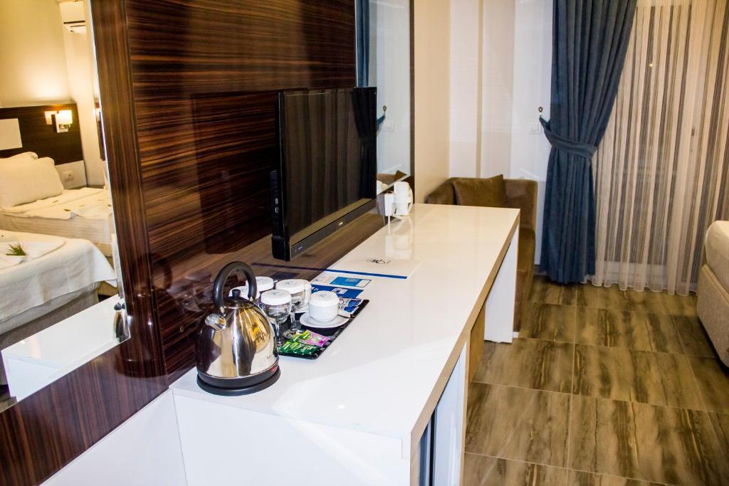 Postel nebo postele na pokoji v ubytování Pamukkale Termal Ece Otel