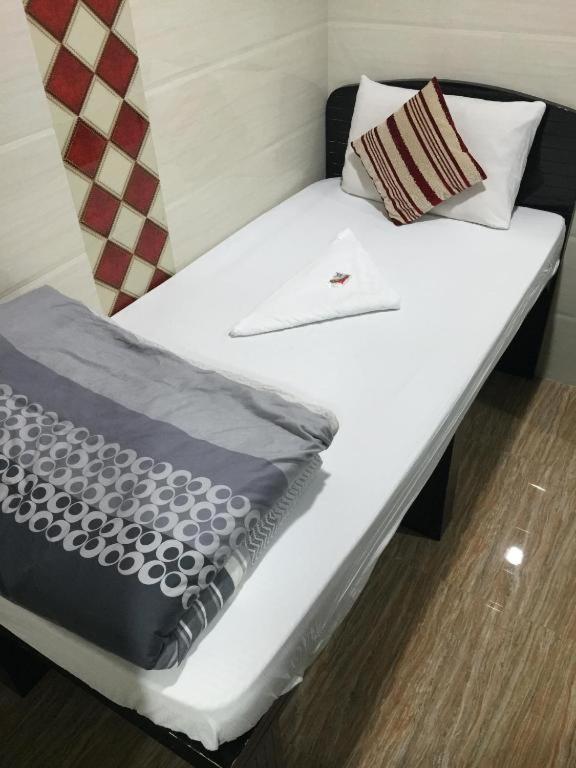 Voodi või voodid majutusasutuse Happy Land Inn 6 F toas