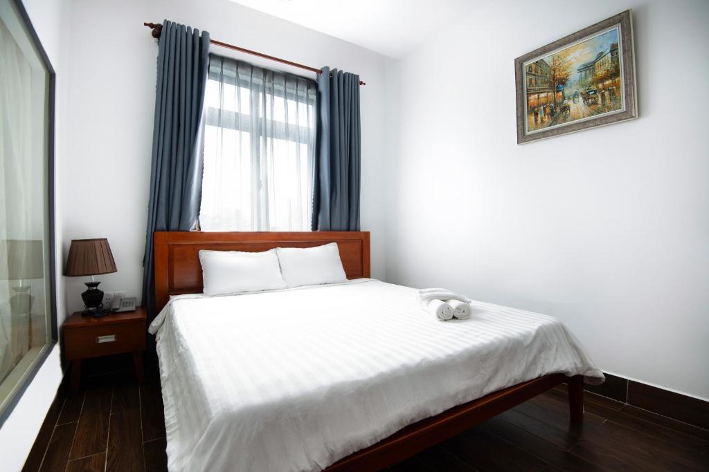 Postel nebo postele na pokoji v ubytování Kim Ngân II hotel